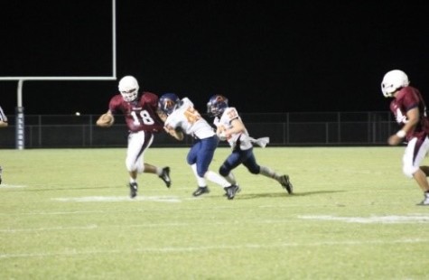 QB Cesar Delgado (#18) running for a 21 yards pick up and a first down.