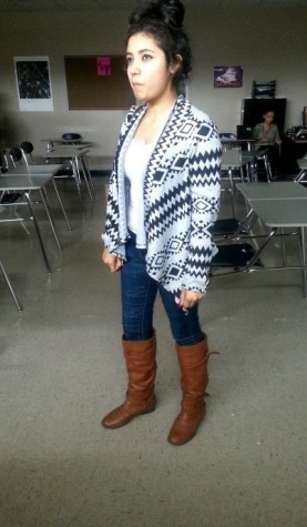 Inderella Aguilar 16’ posing with her shinny brown boots 