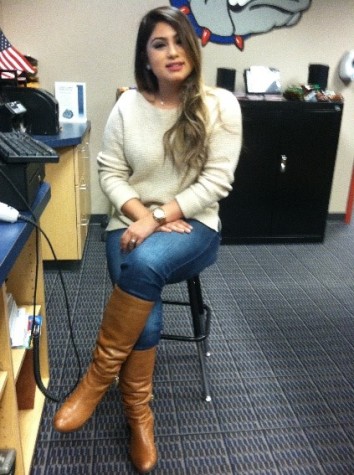   Photo Courtesy of Larry Ross Stephanie Lopez 15’ chilling in the bookstore with her brown boots and nice white sweater 