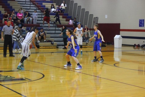 Jenay B. (#1) taking defender one on one, while Janae G. (#11) opens up for a pass