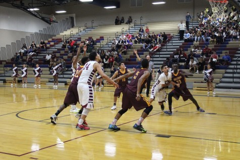 Both teams rushing for the rebound after junior Dontae A. shoots a free throw