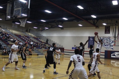Junior point guard Donte A. (#3) scoring from three point range