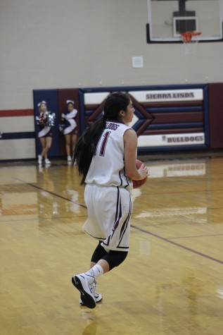 Janae Gonzalez looking for an open lane to pass the ball. 