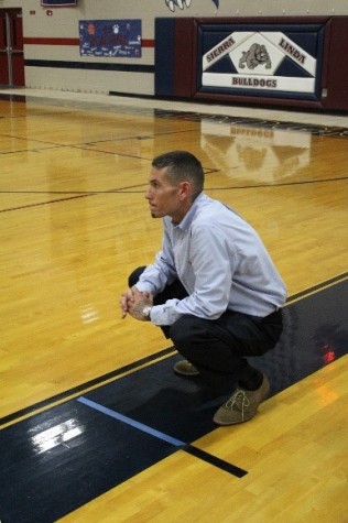 Coach Haagensen watching his Bulldog’s playing with intensity  