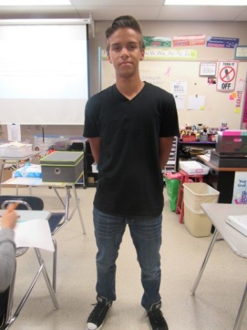 SLHS Sophomore Don M. is wearing a black v-neck with slim jeans and black Converse’s.