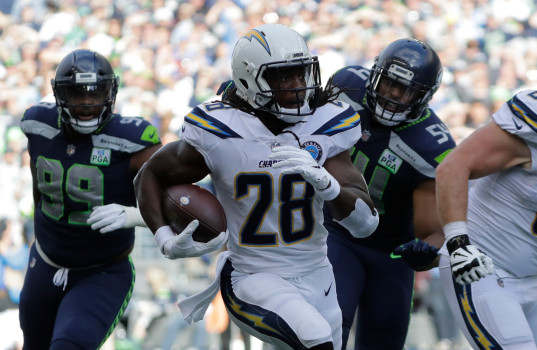 Los Angeles Chargers' Melvin Gordon runs for a touchdown against the Seattle Seahawks during the first half of an NFL football game, Sunday, Nov. 4, 2018, in Seattle. (AP Photo/Ted S. Warren)